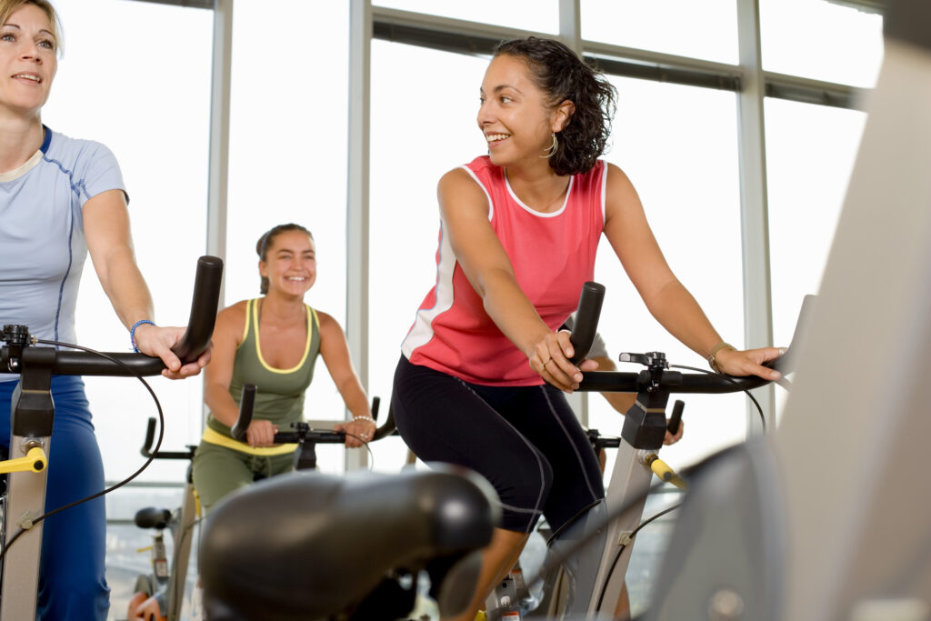 people on exercise bikes
